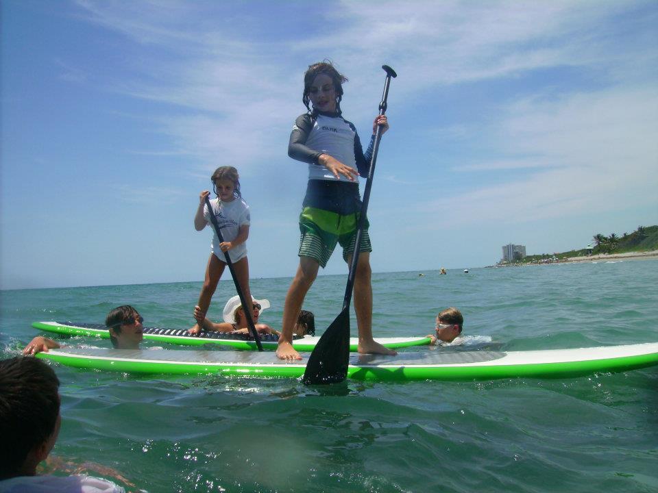 Campers on paddleboards off the Florida coast